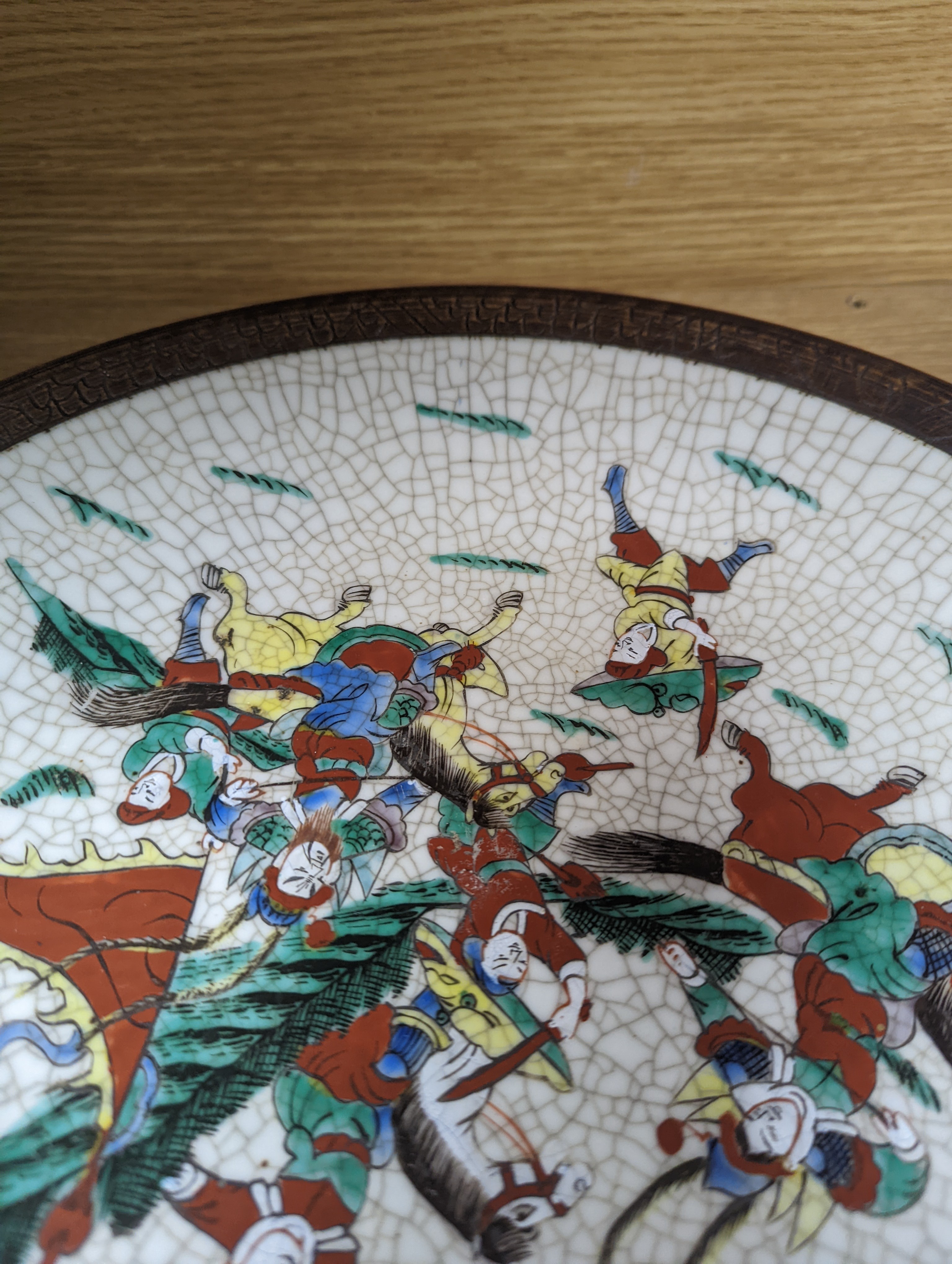 A Chinese famille verte 'warriors' crackle glaze dish 33cm